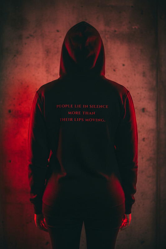 Black woman wearing Dosdru People Lie in Silence hoodie, back view, crimson text on black, dark cinematic mood